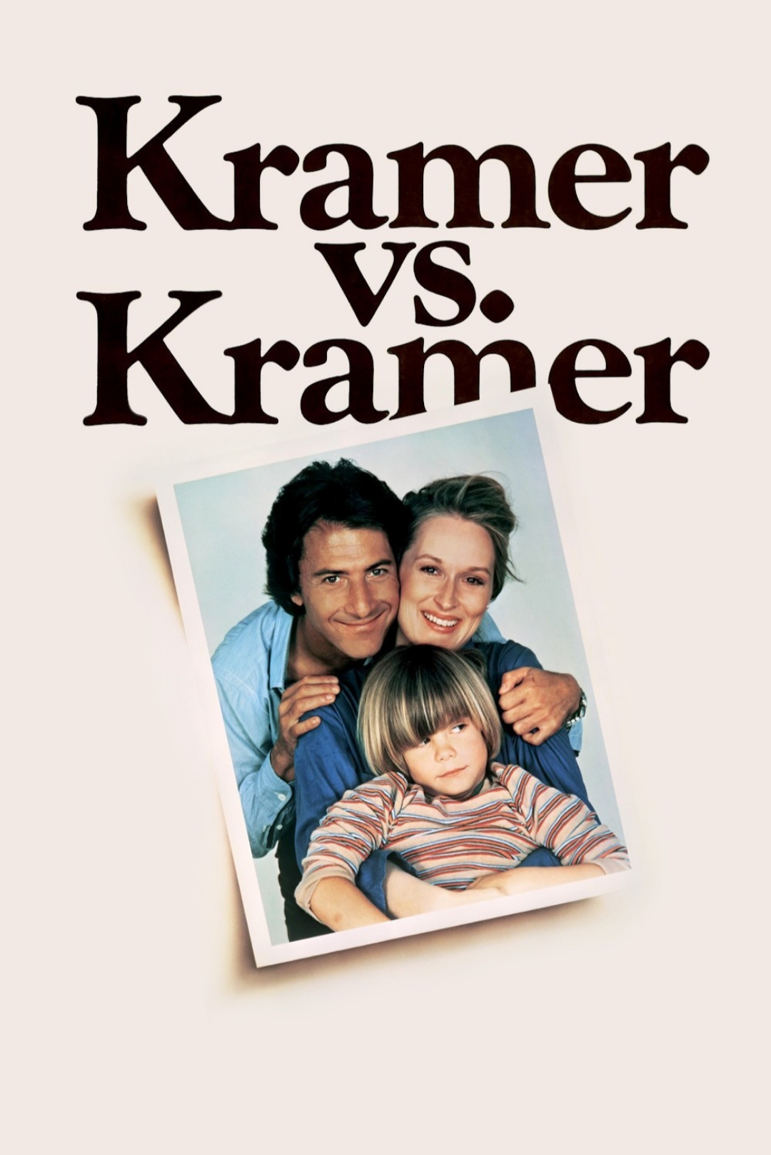 A movie poster for "Kramer vs. Kramer" featuring a man, woman, and young boy smiling, with the film title in bold black letters above a photograph of the three together.
