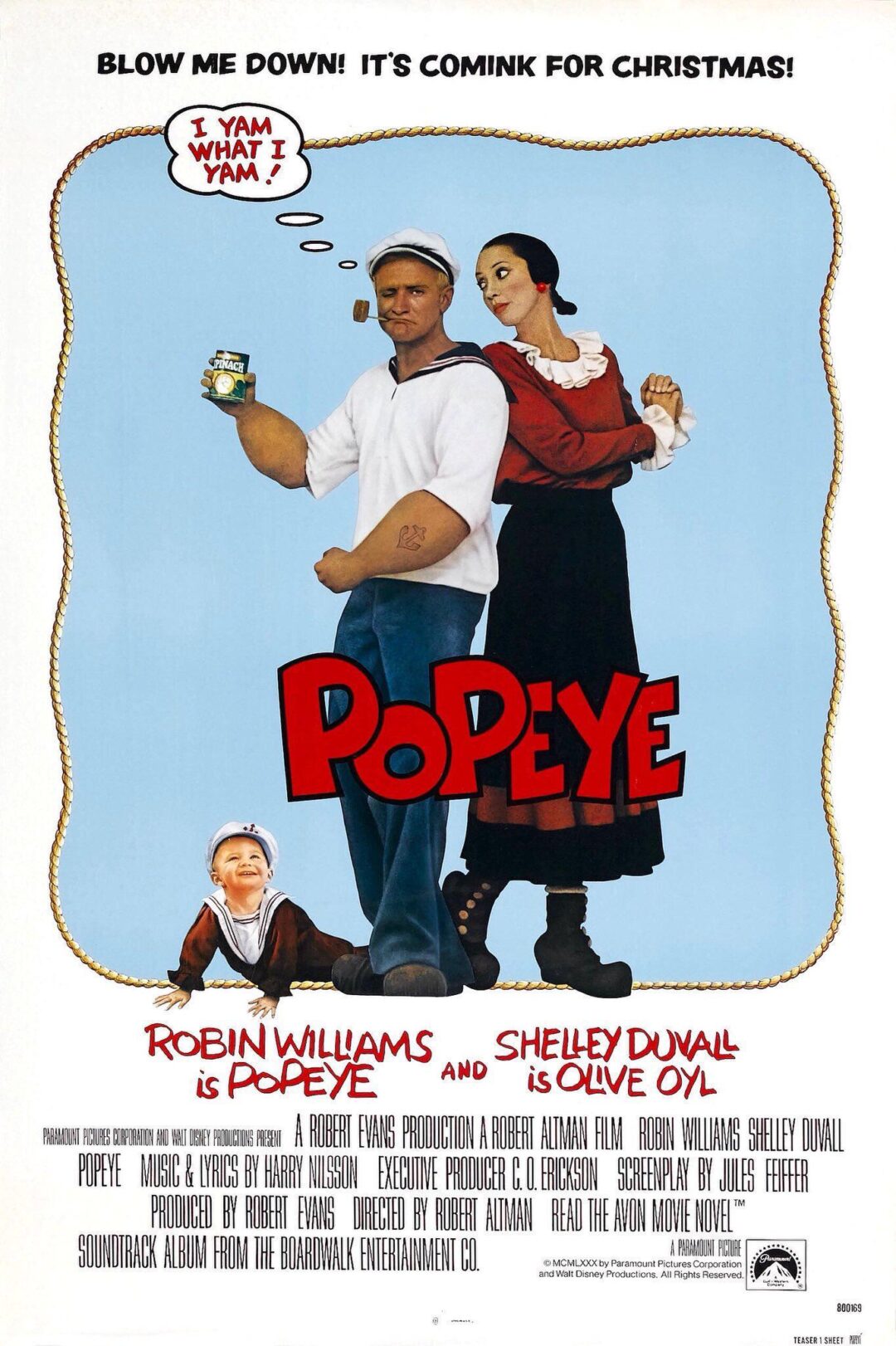 Movie poster for "Popeye" featuring Robin Williams as Popeye, holding a can of spinach, and Shelley Duvall as Olive Oyl, blowing a heart-shaped kiss. The tagline reads, "Blow me down! It's comink for Christmas!