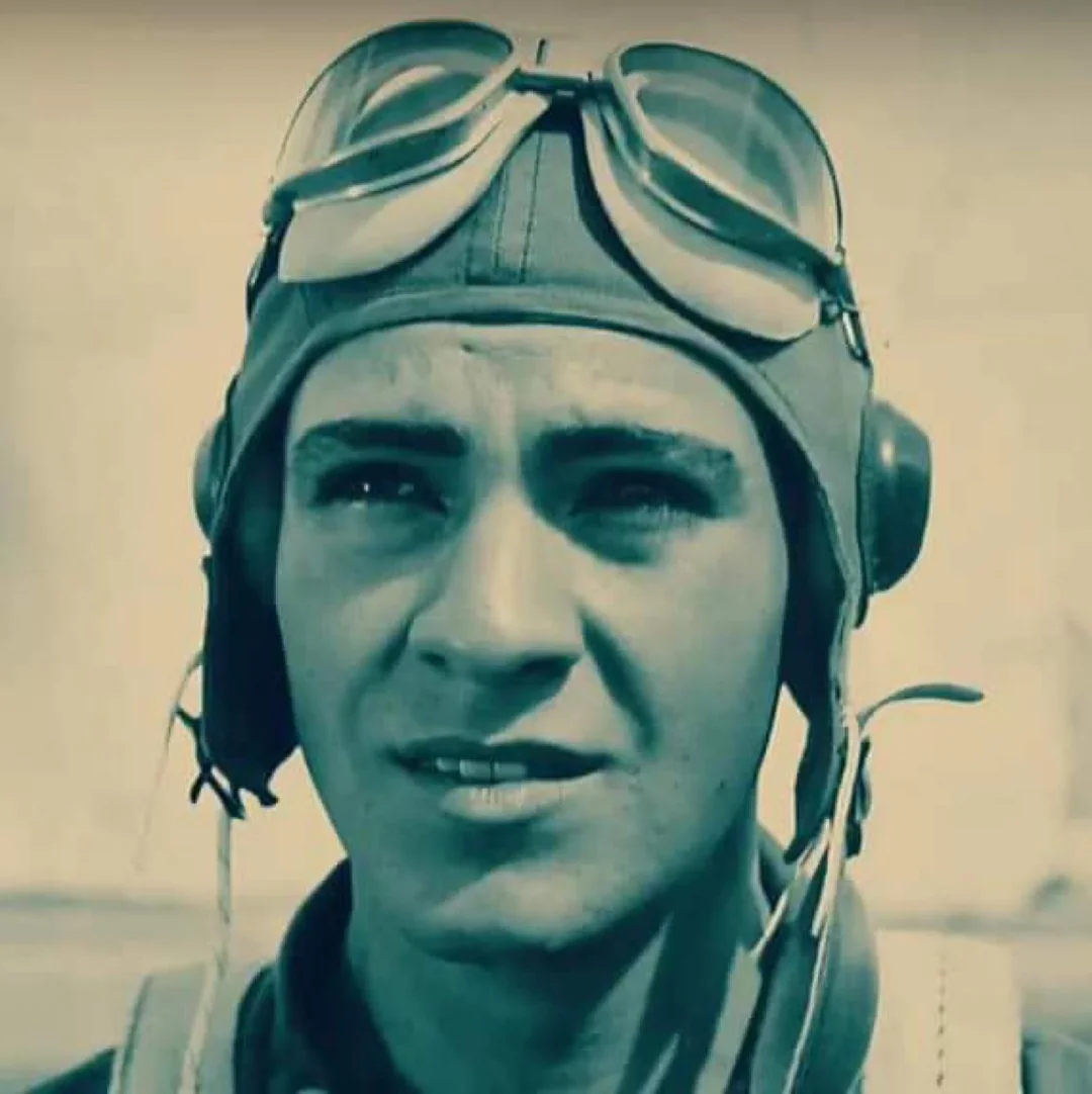 A young pilot wearing a leather flight helmet, goggles, and a headset looks into the distance with a determined expression. The image has a vintage, sepia-toned effect.