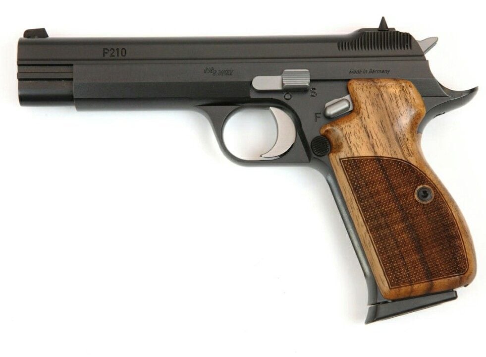 A black semi-automatic handgun with a wooden textured grip is shown on a white background. The side of the barrel is marked "P210" and "Made in Germany.