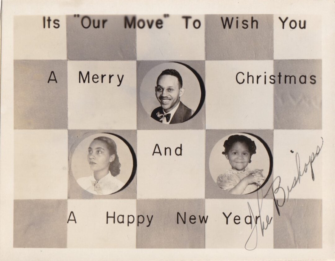 Vintage holiday card with chessboard pattern, three black-and-white photos—a man, a woman, and a young girl—each inside a circle, and text reading: "It's Our Move To Wish You A Merry Christmas And A Happy New Year.