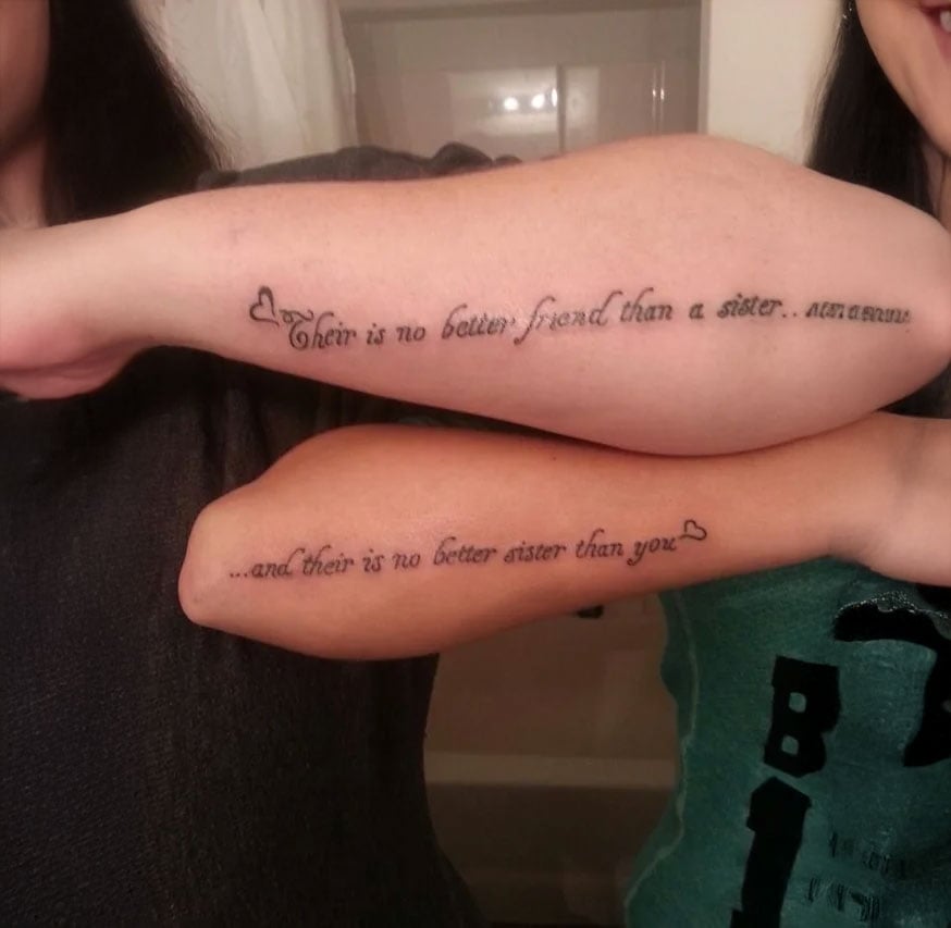 Two people show matching forearm tattoos. The tattoos read: “There is no better friend than a sister…” and “…and there is no better sister than you.” Both tattoos are styled with small hearts.