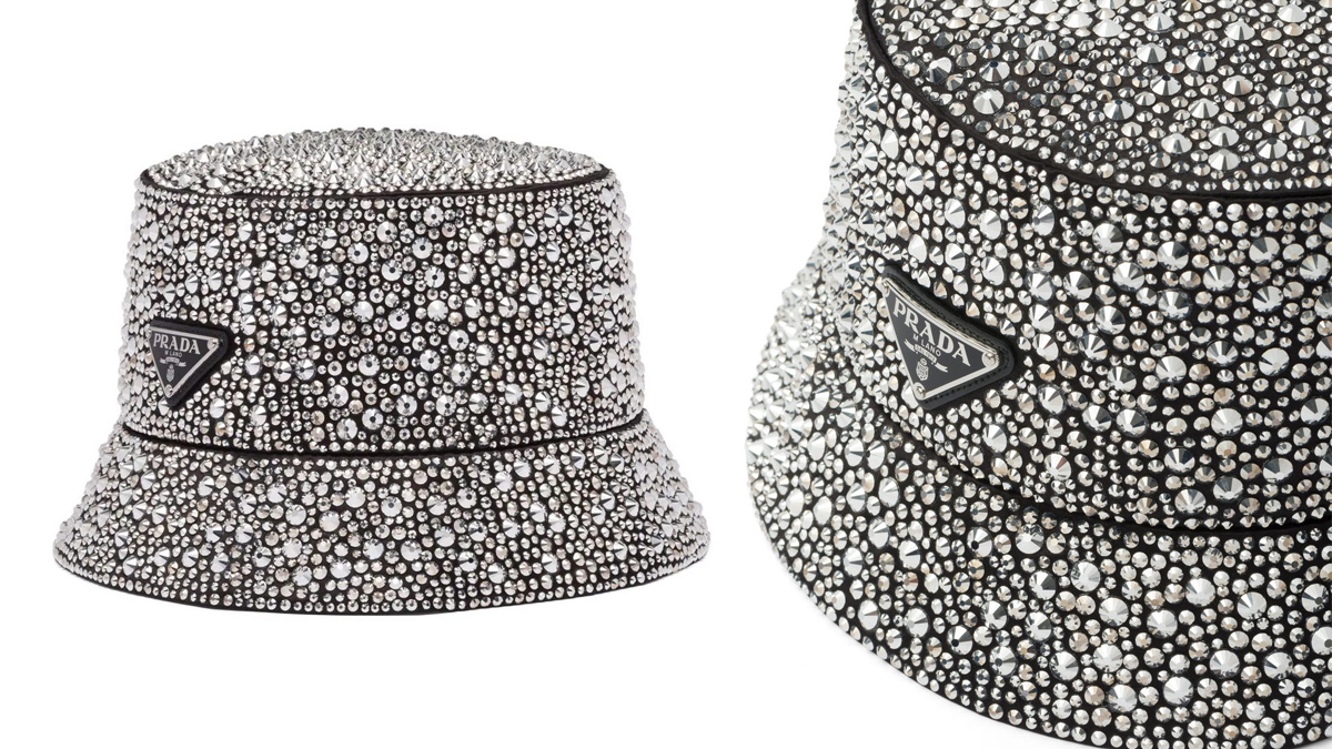 A Prada bucket hat covered in sparkling crystals, shown in full view on the left and a close-up detail of the crystals and Prada logo on the right. The hat has a luxurious, shiny appearance.