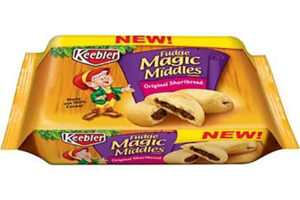 A package of Keebler Fudge Magic Middles Original Shortbread cookies, featuring an elf mascot, the cookies with a chocolate center, and a yellow banner reading "NEW!" across the top.