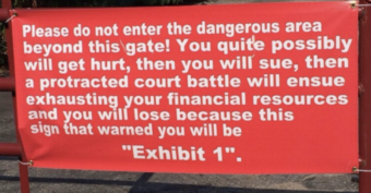 A red warning sign reads: "Please do not enter the dangerous area beyond this gate! You quite possibly will get hurt, then you will sue, then a protracted court battle will ensue... this sign that warned you will be 'Exhibit 1'.