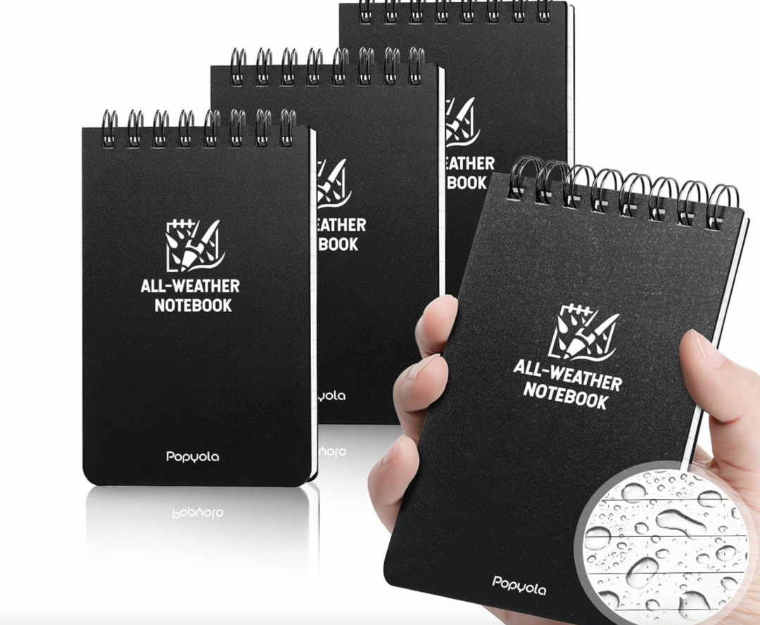 Four black spiral-bound notebooks labeled "All-Weather Notebook" are shown, with one held in a hand. An inset shows water droplets on a page, highlighting the notebook’s water-resistant feature.