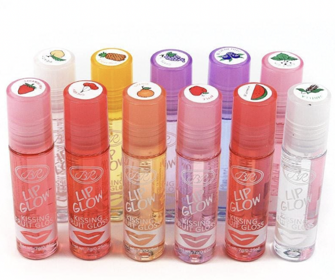 Nine tubes of fruity flavored lip gloss are arranged in two rows, each with colorful caps featuring fruit images such as strawberry, orange, and watermelon, and labeled "Lip Glow Kissing Fruit Gloss.