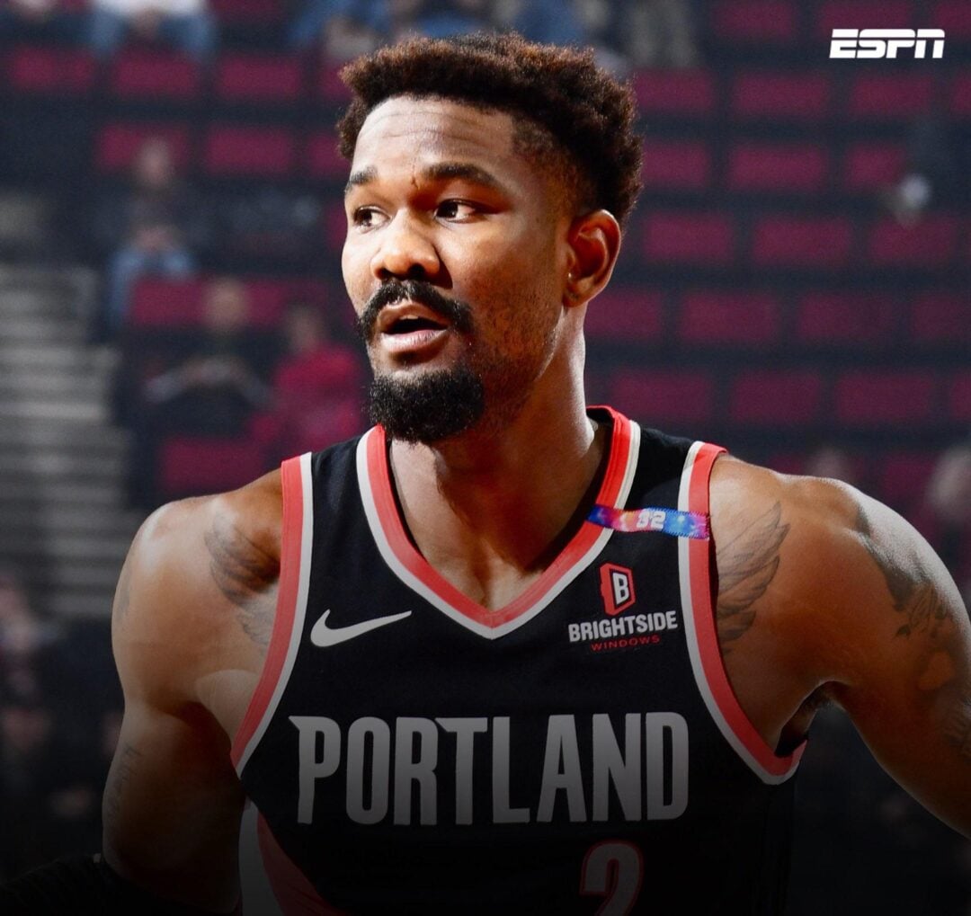 A basketball player in a Portland jersey stands on the court. The image has a "Breaking News" banner and the ESPN logo in the corner, with "From Shams Charania" in smaller text below.