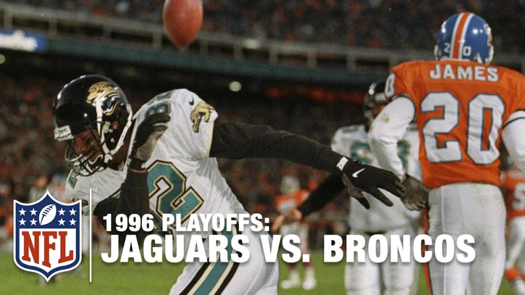 A Jacksonville Jaguars player celebrates in front of a Denver Broncos player during the 1996 NFL Playoffs, with the text “1996 Playoffs: Jaguars vs. Broncos” and the NFL logo overlaid on the image.