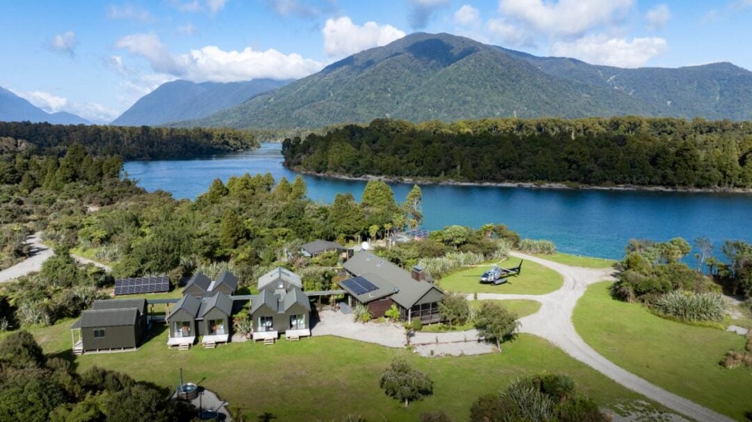 A basketball player wearing a yellow Los Angeles Lakers jersey with the number 15 stands on the court, looking focused during a game.