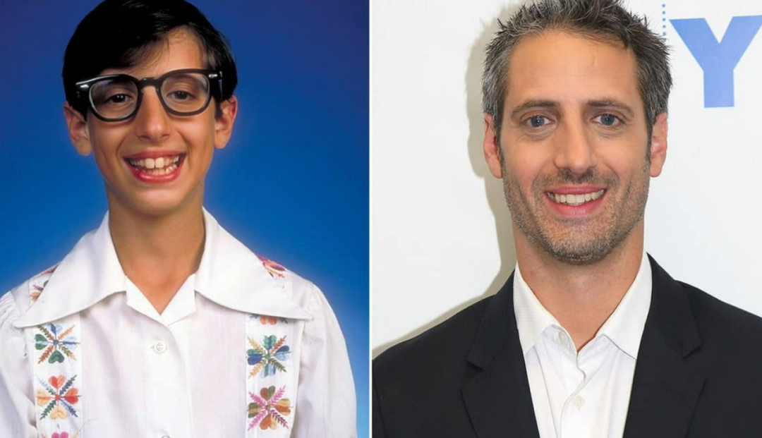 Side-by-side photos of a person as a child wearing large glasses and a white shirt with colorful embroidery, and as an adult with short hair, no glasses, and wearing a black jacket over a white shirt.