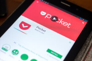 A tablet screen displays the Pocket app page on the Google Play Store, showing the app logo, name, and an "Install" button, with part of the device visible on the right side.