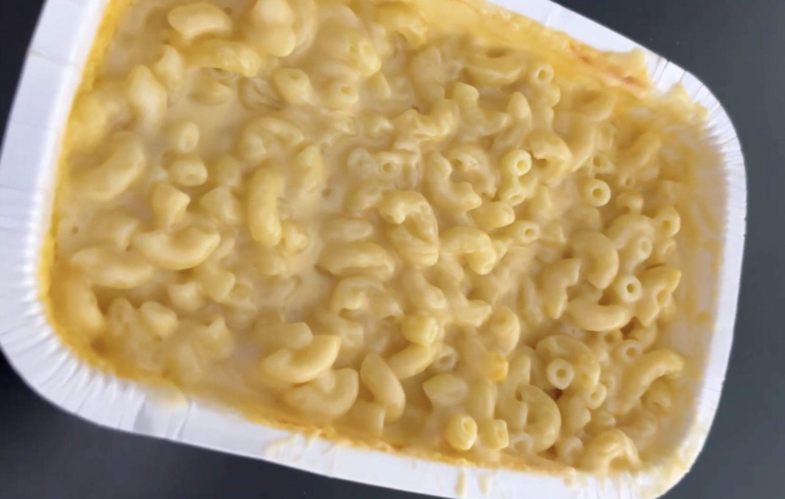 Macaroni and cheese in a rectangular white tray.