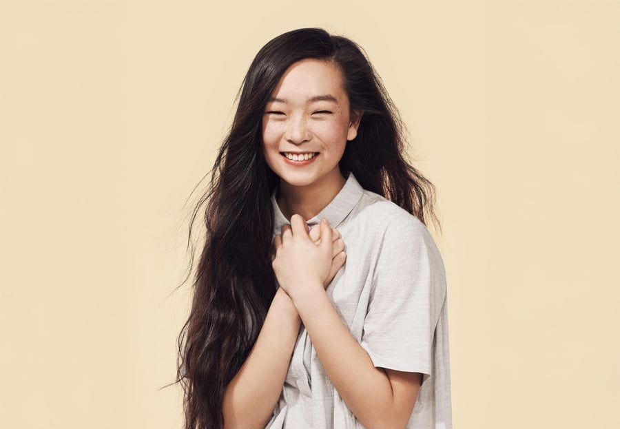 A woman with long hair smiling