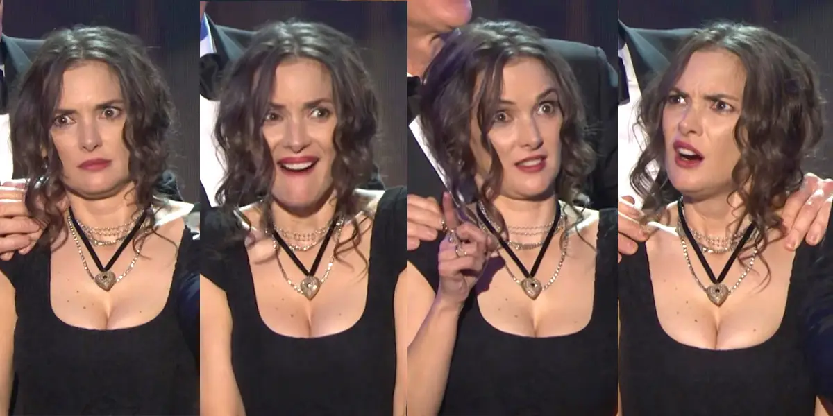 A woman with wavy brown hair and a black dress displays four different surprised and confused facial expressions while standing on stage.