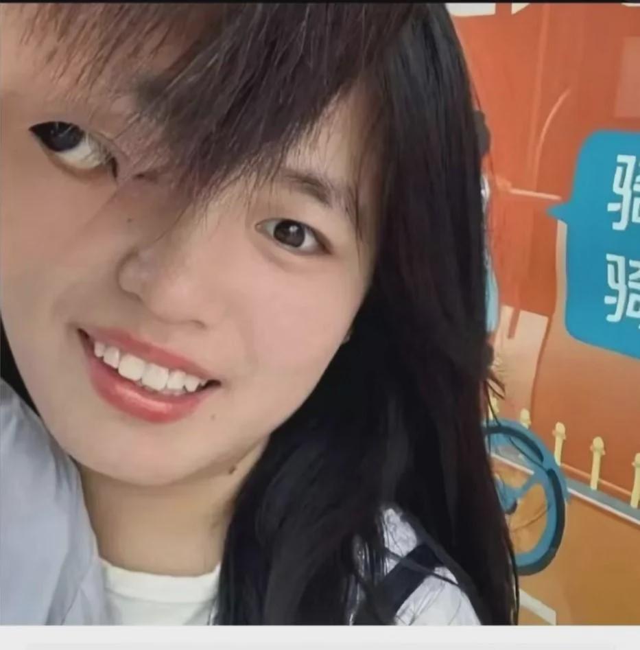 A young woman with long dark hair smiles at the camera. The image is digitally altered, showing her face duplicated and misaligned, creating a surreal effect. A colorful background with blue text and graphics is partially visible.