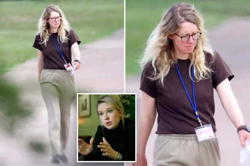 A woman with long blonde hair and glasses, wearing a brown t-shirt, khaki pants, and a blue lanyard walks outdoors. Inset shows her wearing black, speaking with expressive hands.