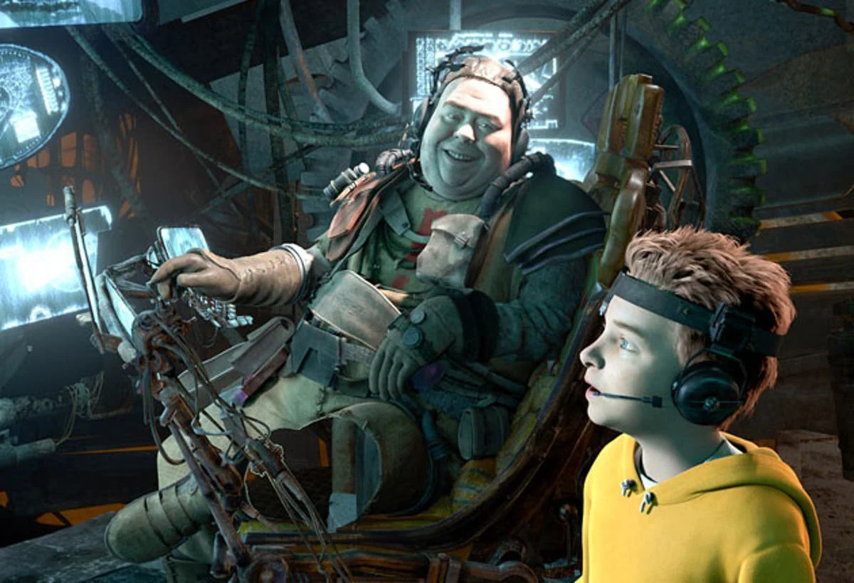 A scene from an animated film shows a smiling, heavy-set man with headgear sitting in a cluttered chair next to a young boy in a yellow hoodie wearing a headset, surrounded by glowing screens and machinery.