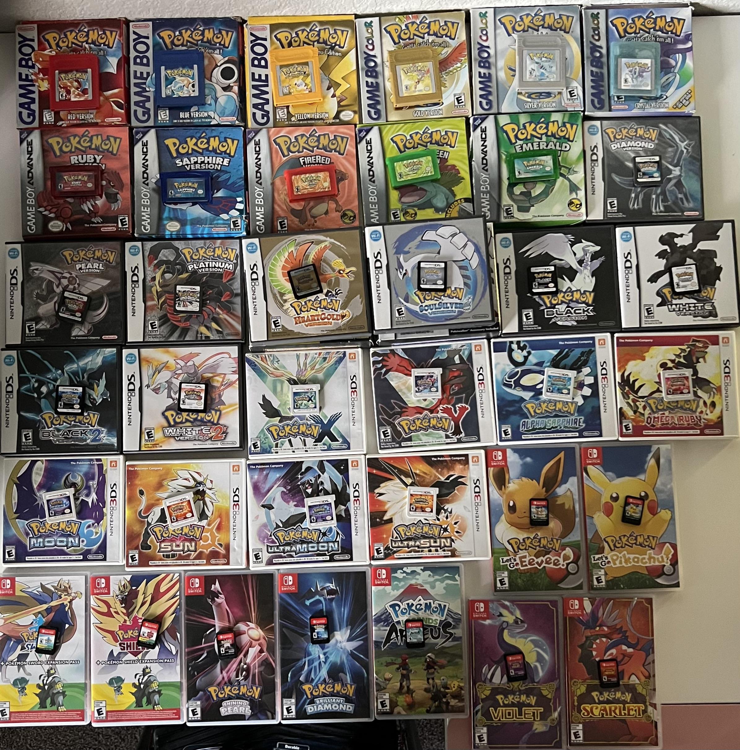 A collection of Pokémon video game covers for Game Boy, Game Boy Advance, DS, 3DS, and Nintendo Switch, including main series titles from Pokémon Red to Scarlet and Violet, arranged neatly in rows on a flat surface.