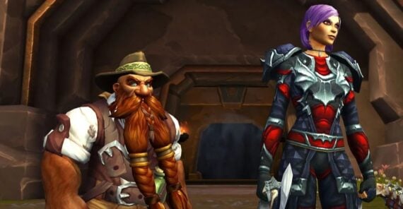 A dwarf with a long orange beard, wearing a hat and explorer's attire, stands beside a tall, armored woman with short purple hair and a sword, in a fantasy setting with a stone archway behind them.