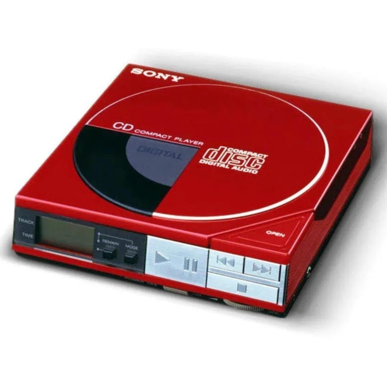 A red Sony portable CD compact disc player featuring control buttons and a digital display on the front panel, with "compact disc digital audio" printed on the lid.