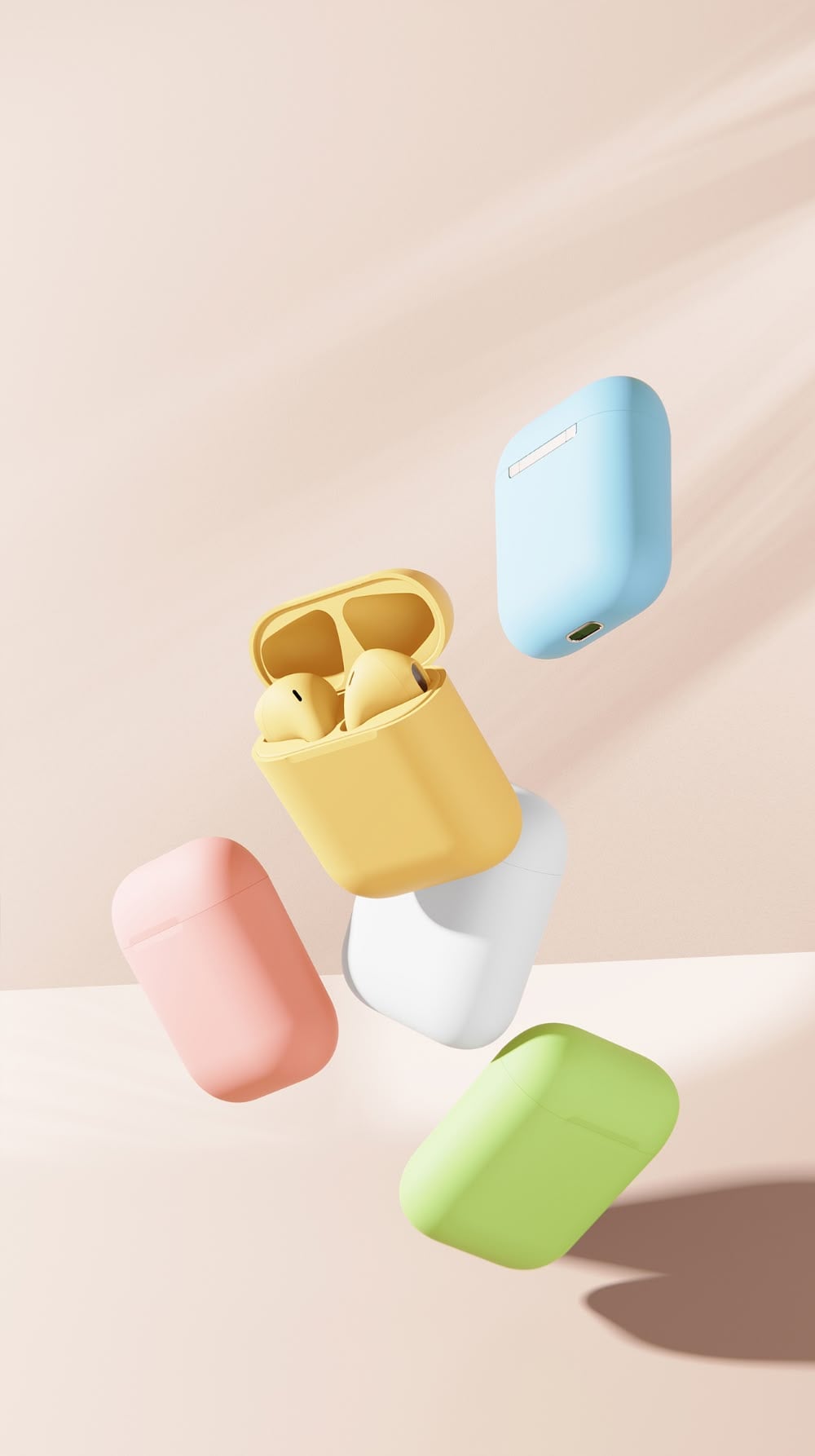 Colorful wireless earbuds cases in pastel shades of yellow, blue, pink, white, and green are floating against a soft beige background. The yellow case is open, revealing the earbuds inside.