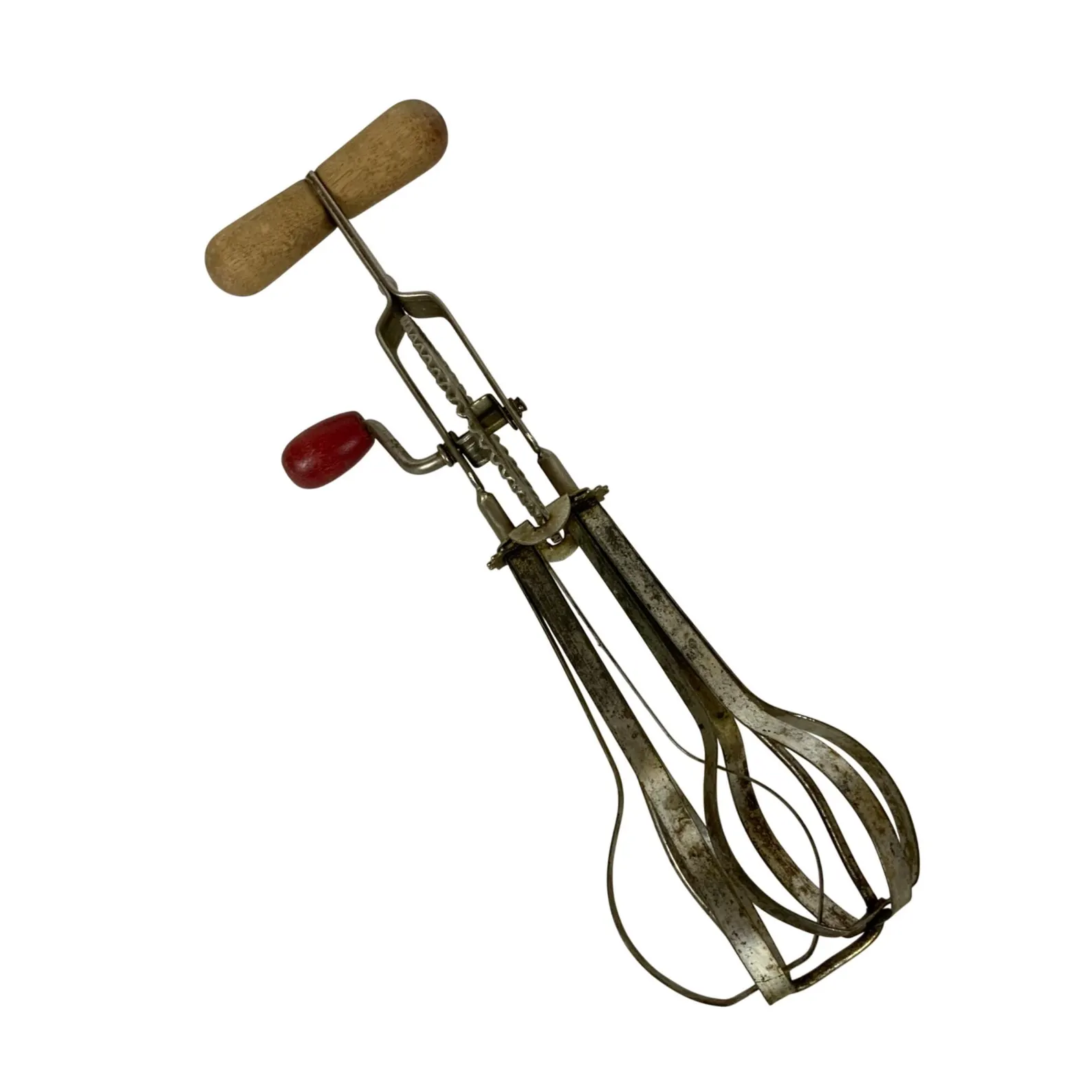 A vintage hand-crank egg beater with two metal beaters, a red wooden handle, and a tan wooden grip, isolated on a white background.