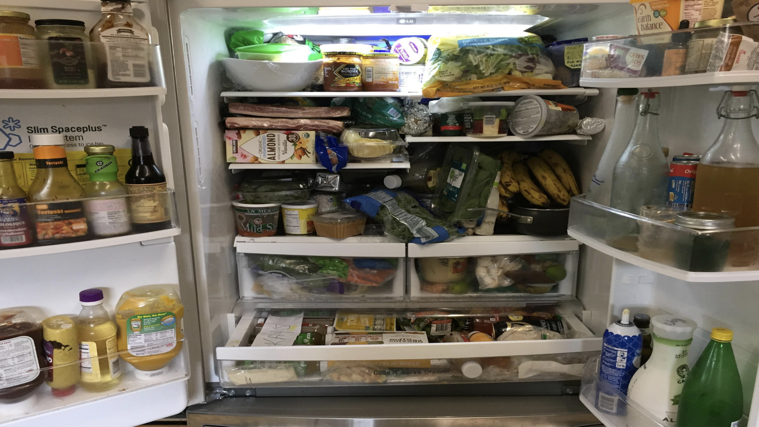 Items showing a full organized fridge with groceries