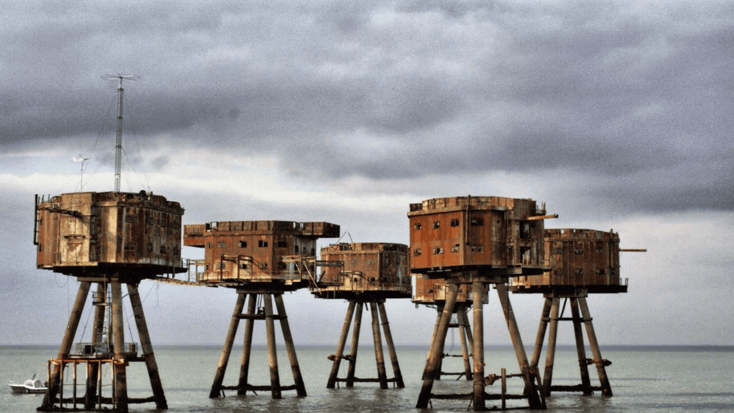 Abandoned Maunsell sea forts in England standing in the ocean rusting