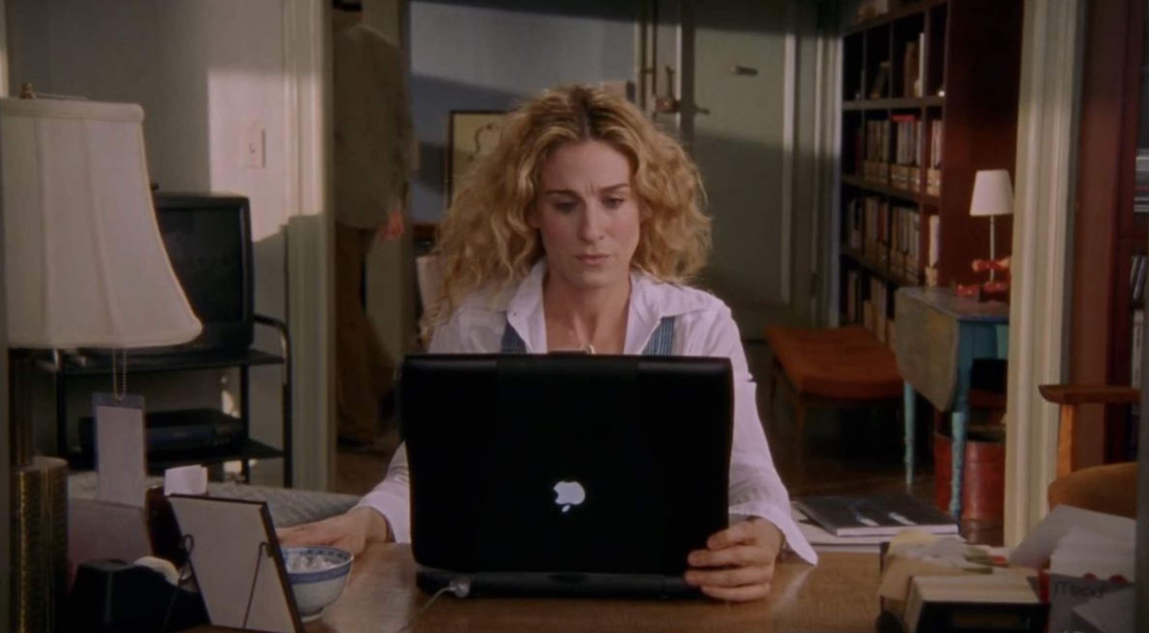 Writing online content on laptop to make money from home