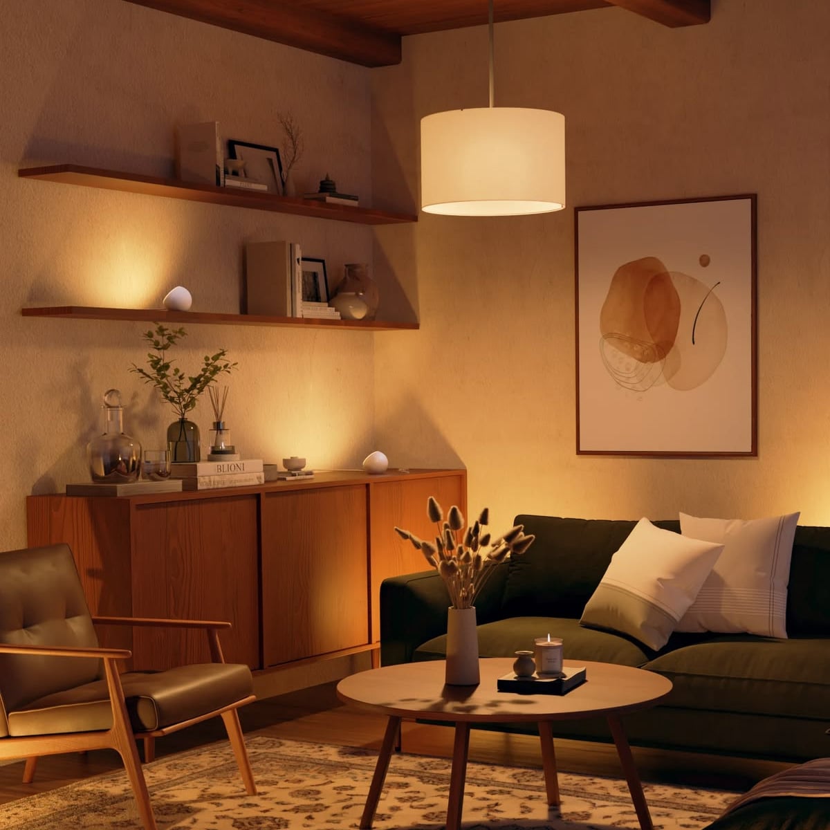 A cozy living room with a dark green sofa, armchair, round wooden coffee table, shelves with books and decor, a large abstract art piece on the wall, and warm ambient lighting from a pendant lamp. House.