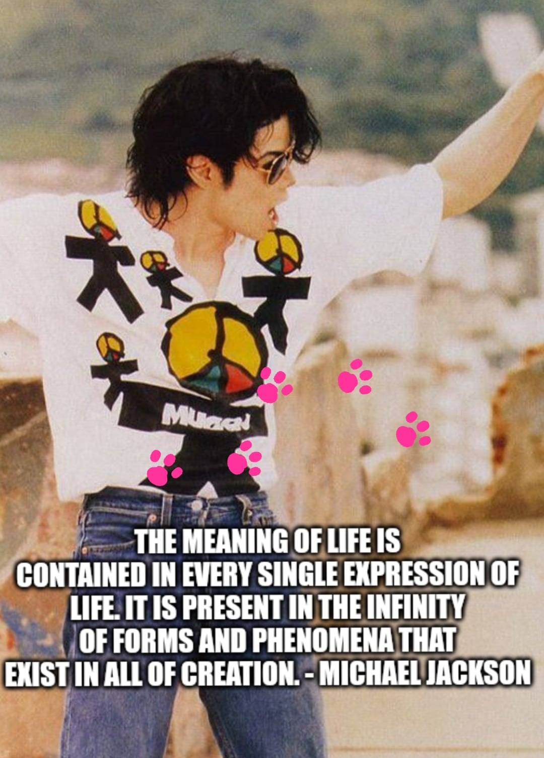 A person in sunglasses and a graphic T-shirt poses with one arm raised. Text at the bottom reads: "The meaning of life is contained in every single expression of life... - Michael Jackson." Pink paw prints are on the image.
