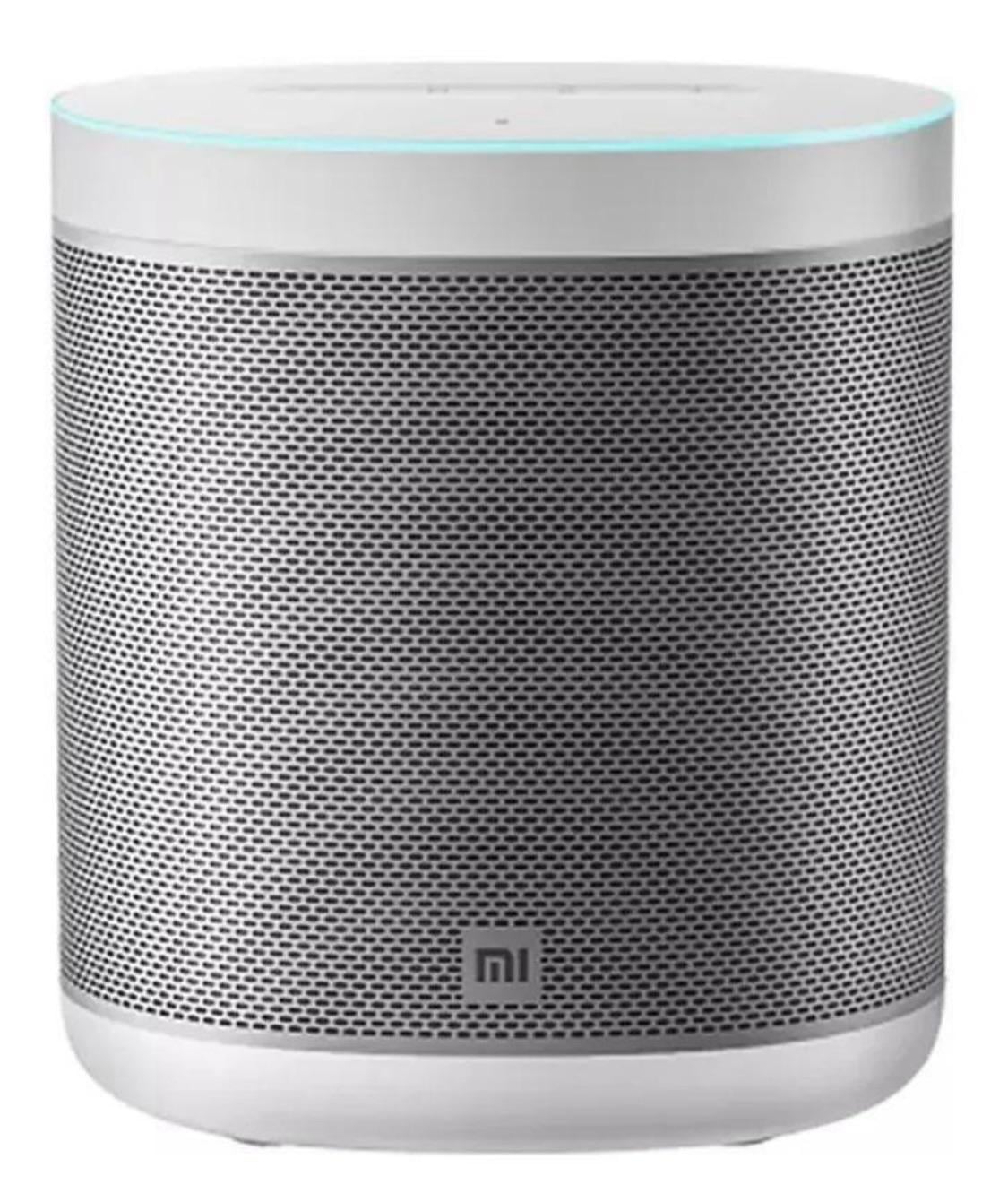 A white, cylindrical smart speaker with a mesh grille, a glowing blue ring on top, and the Mi logo on the front.