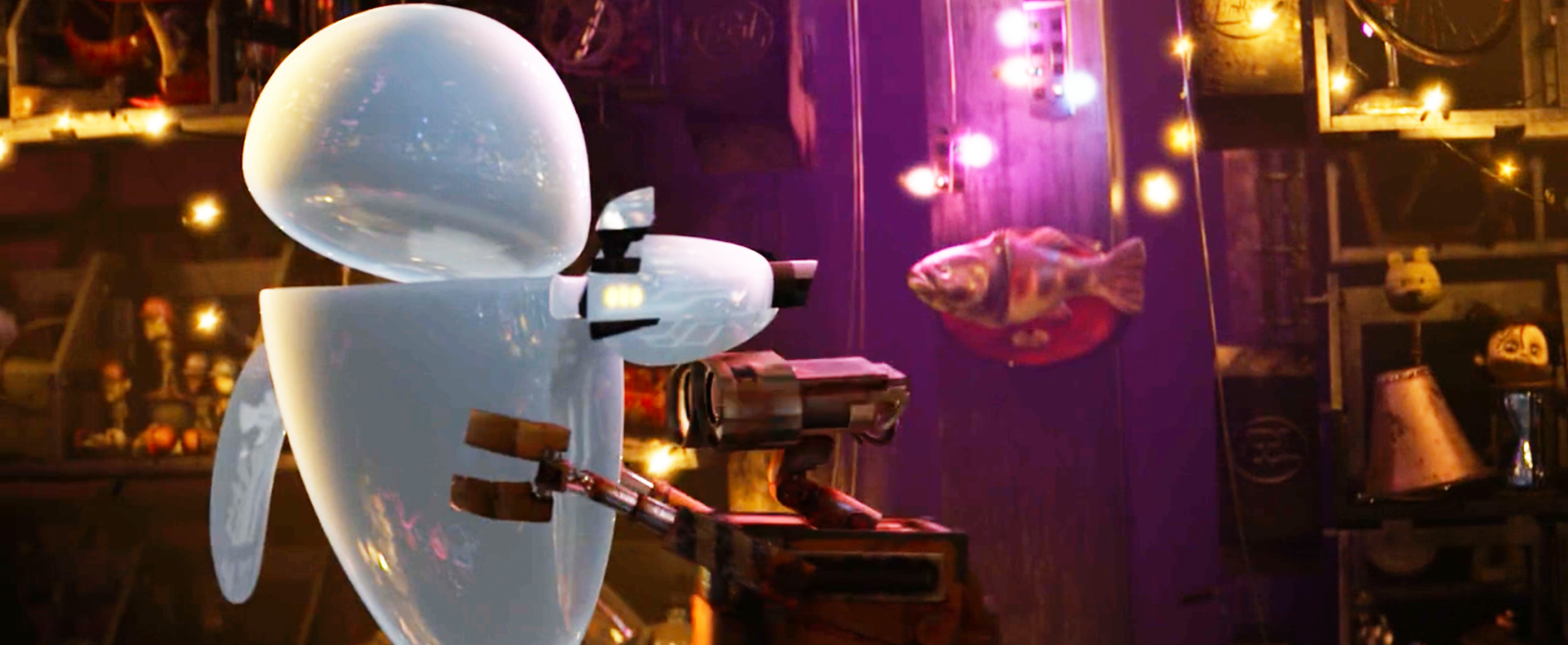 A shiny white robot and a rusty robot reach toward each other in a warmly lit, cluttered room decorated with lights and a mounted fish on the wall.
