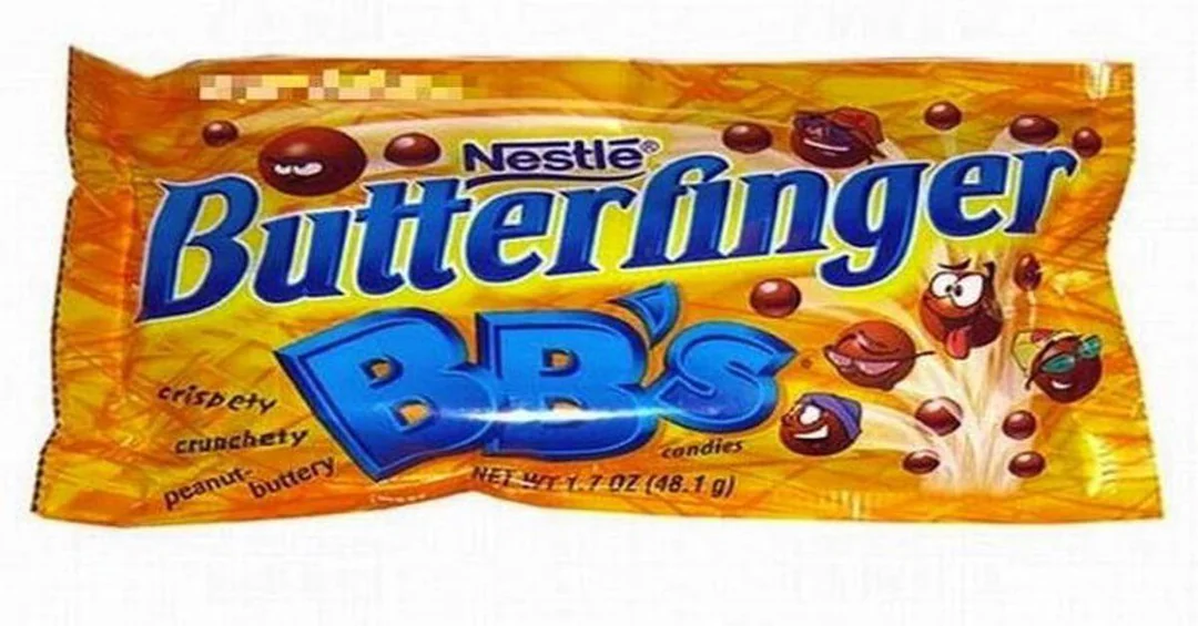 A yellow bag of Nestlé Butterfinger BB’s candies, featuring animated chocolate balls with faces, and text describing them as crispy, crunchy, peanut buttery candies.