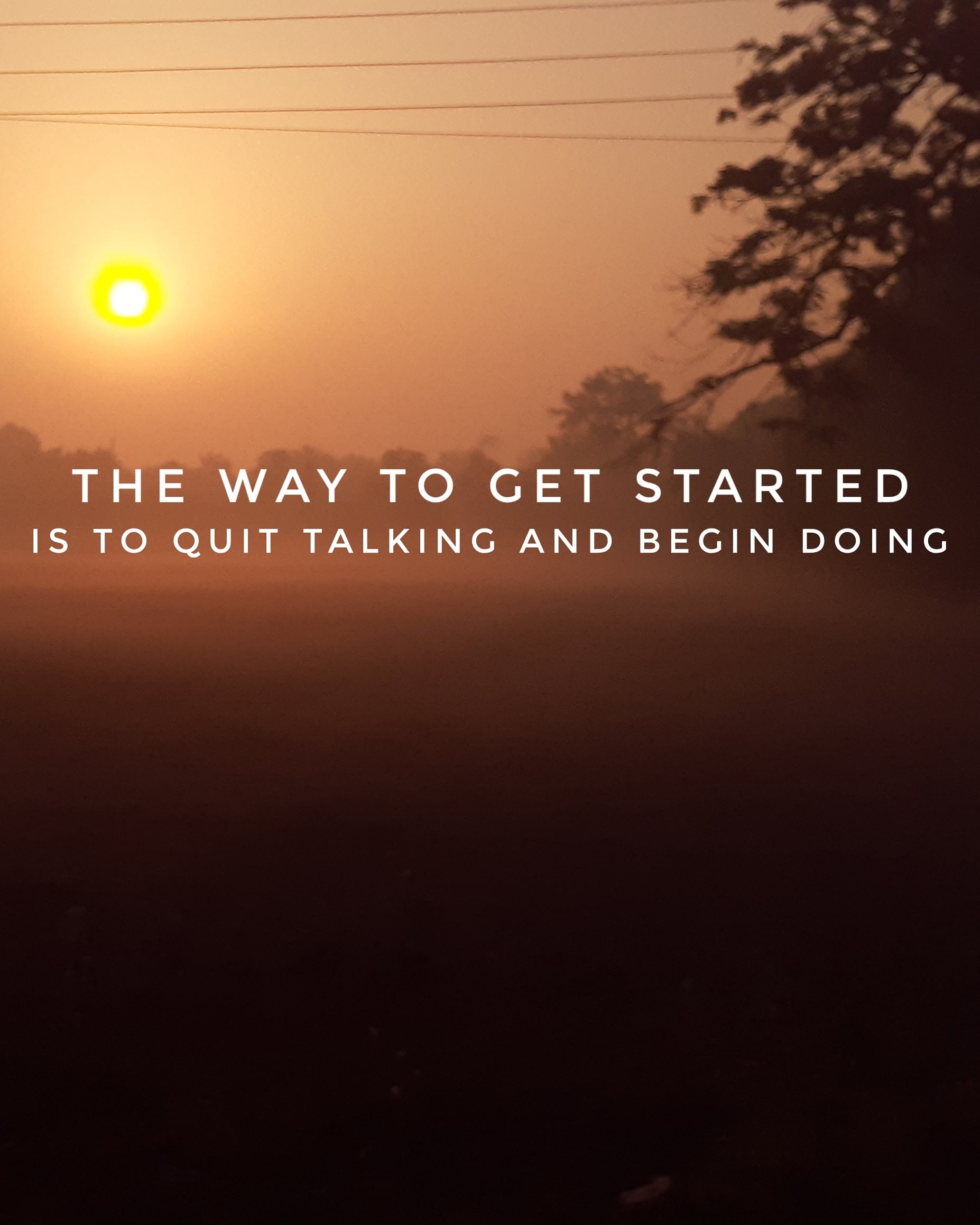 Sunrise with a misty landscape and tree silhouettes. Overlaid text reads, "The way to get started is to quit talking and begin doing.