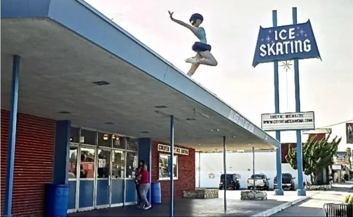 A person in ice skating attire appears to be leaping off the roof of an ice skating rink building, with a large "ICE SKATING" sign visible and people standing outside the entrance.