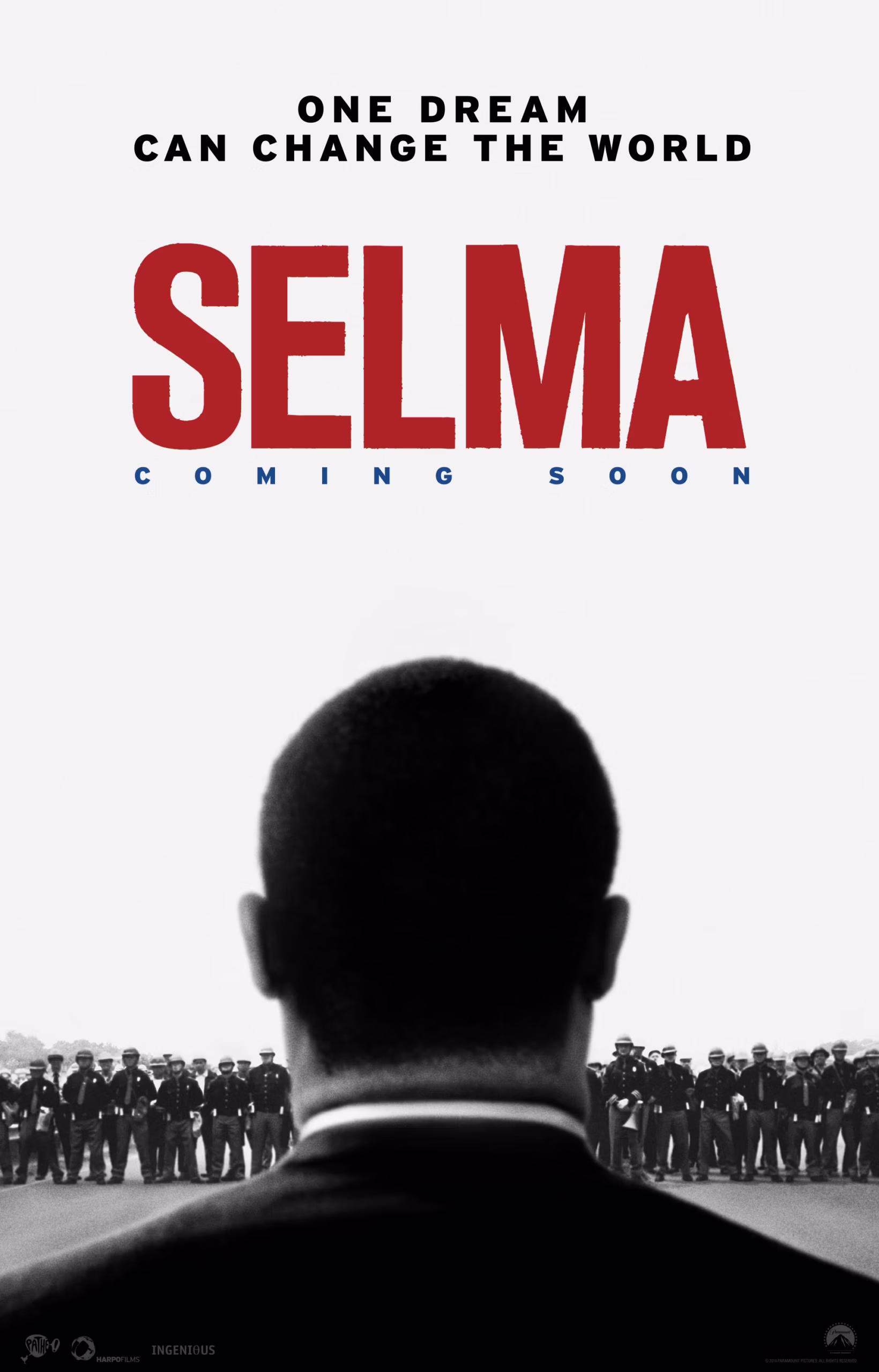 Movie poster for "Selma" featuring the back of a man's head facing a line of police officers. The text reads: "One dream can change the world. SELMA. Coming soon." The image has a black, white, and red color scheme.