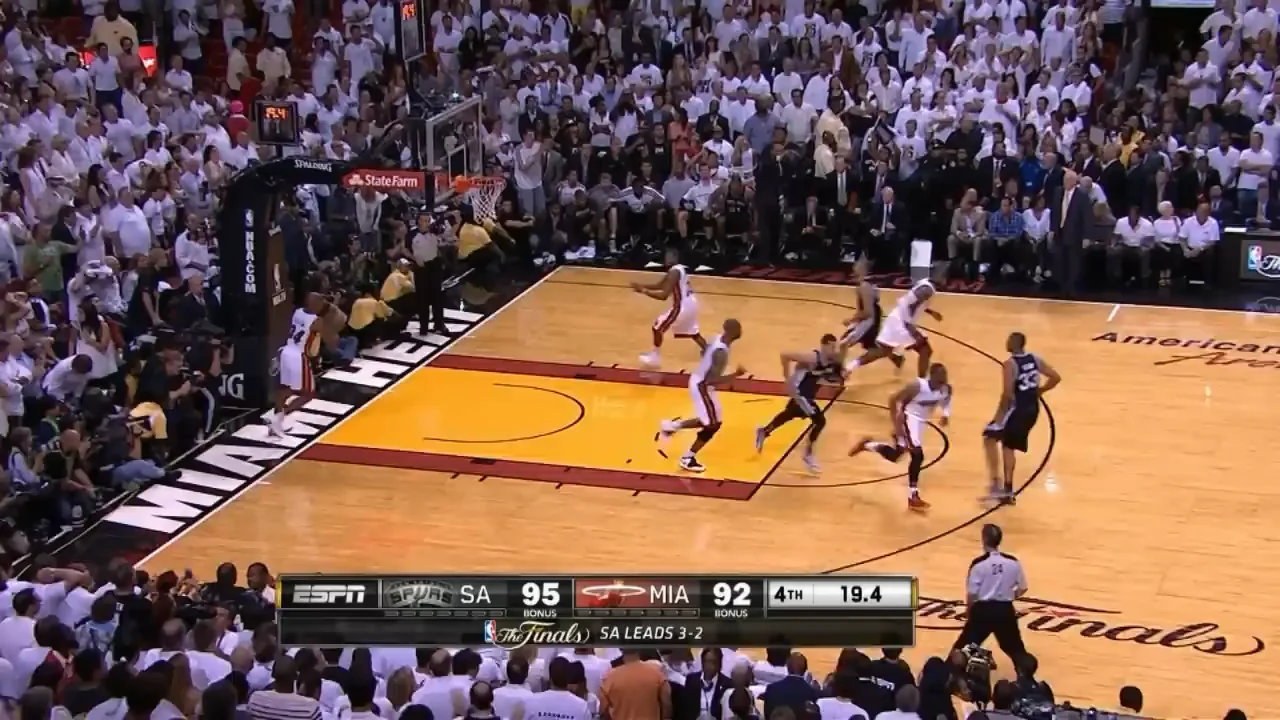A basketball game between the Spurs and Heat shows players in action on the court, with the score 95-92 in favor of San Antonio and 19.4 seconds left in the fourth quarter during the NBA Finals. The crowd is watching intensely.