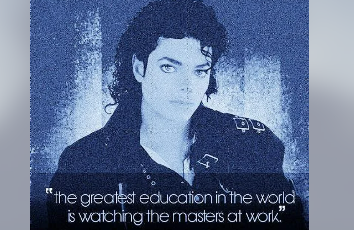 A stylized blue-toned image of a person with curly hair in a black jacket. Text at the bottom reads: "The greatest education in the world is watching the masters at work.