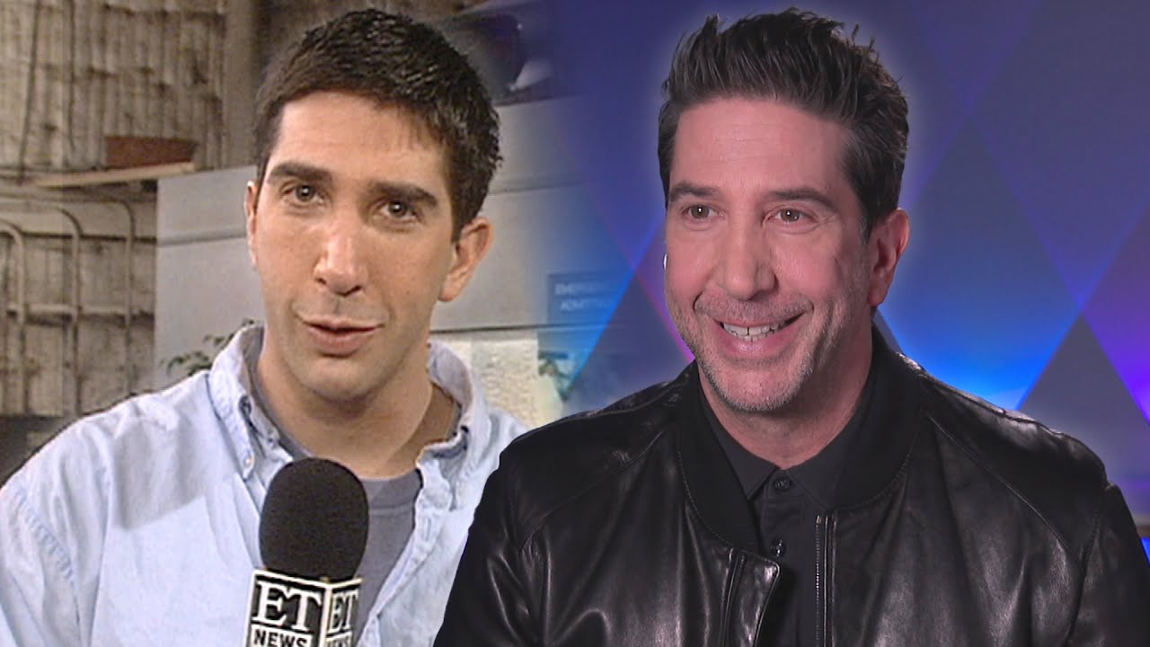 A split image shows David Schwimmer as a young man holding an ET News microphone on the left, and as an older man smiling in a leather jacket on the right, against a purple and blue background.
