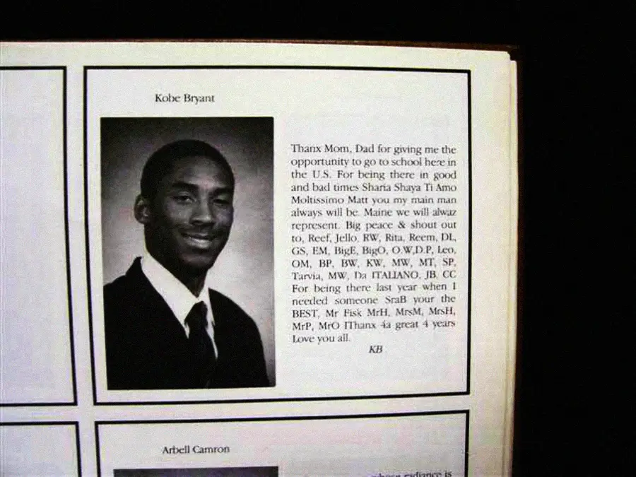 A yearbook page featuring a black-and-white portrait of a young Kobe Bryant in a suit and tie, with a personal message of thanks to his family, written beside the photo.