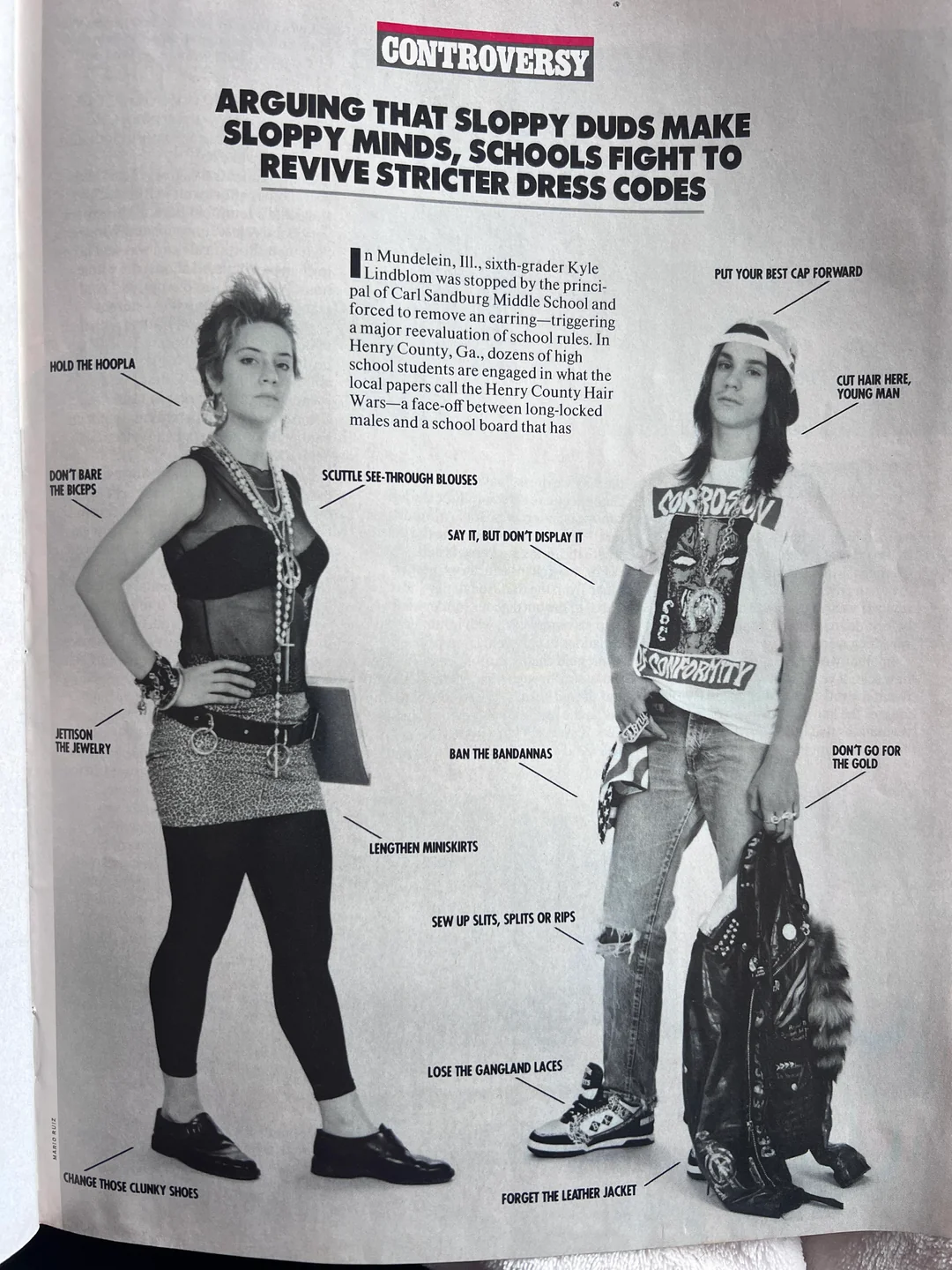 Two teens stand side by side in edgy, casual outfits. The left teen wears a tank top, belt, leggings, and chunky shoes; the right wears a graphic T-shirt, bandana, ripped jeans, and sneakers. Labels point to elements of their styles.