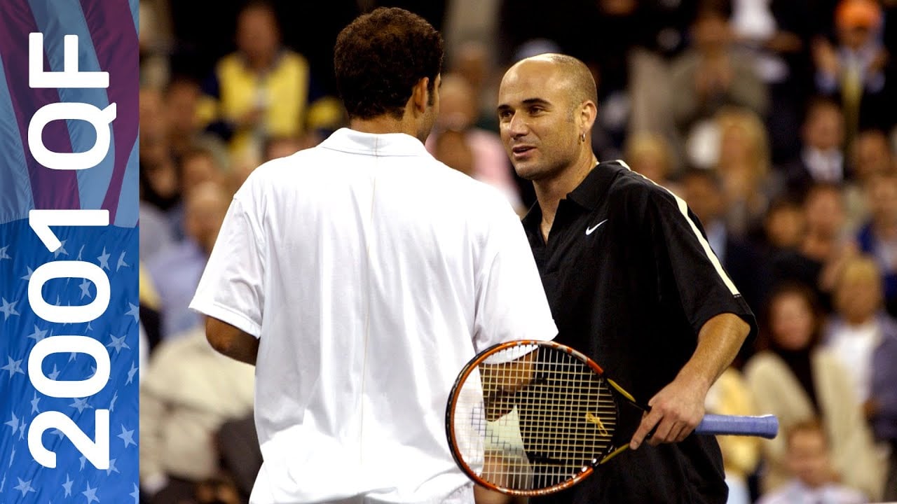 Two male tennis players on court during a match, one in a white shirt with his back to the camera, and the other in a black shirt holding a racquet. “2001 QF” is written on the left side of the image.