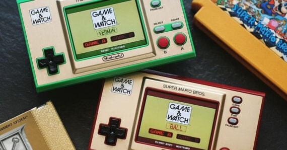 Two Nintendo Game & Watch handheld consoles are displayed, one with green buttons showing &ldquo;VERMIN&rdquo; on screen, the other with red buttons showing &ldquo;BALL.&rdquo; A partially visible Super Mario Bros. box is in the background.