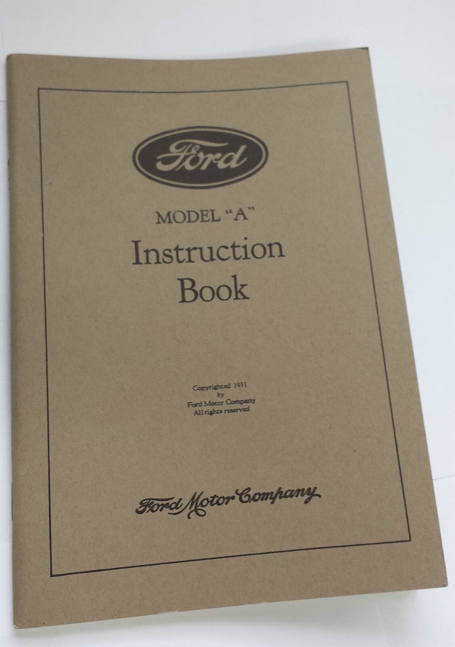 A brown booklet titled "Ford Model 'A' Instruction Book" with black text and a Ford logo on the cover, published by Ford Motor Company in 1931, is shown lying on a white surface.