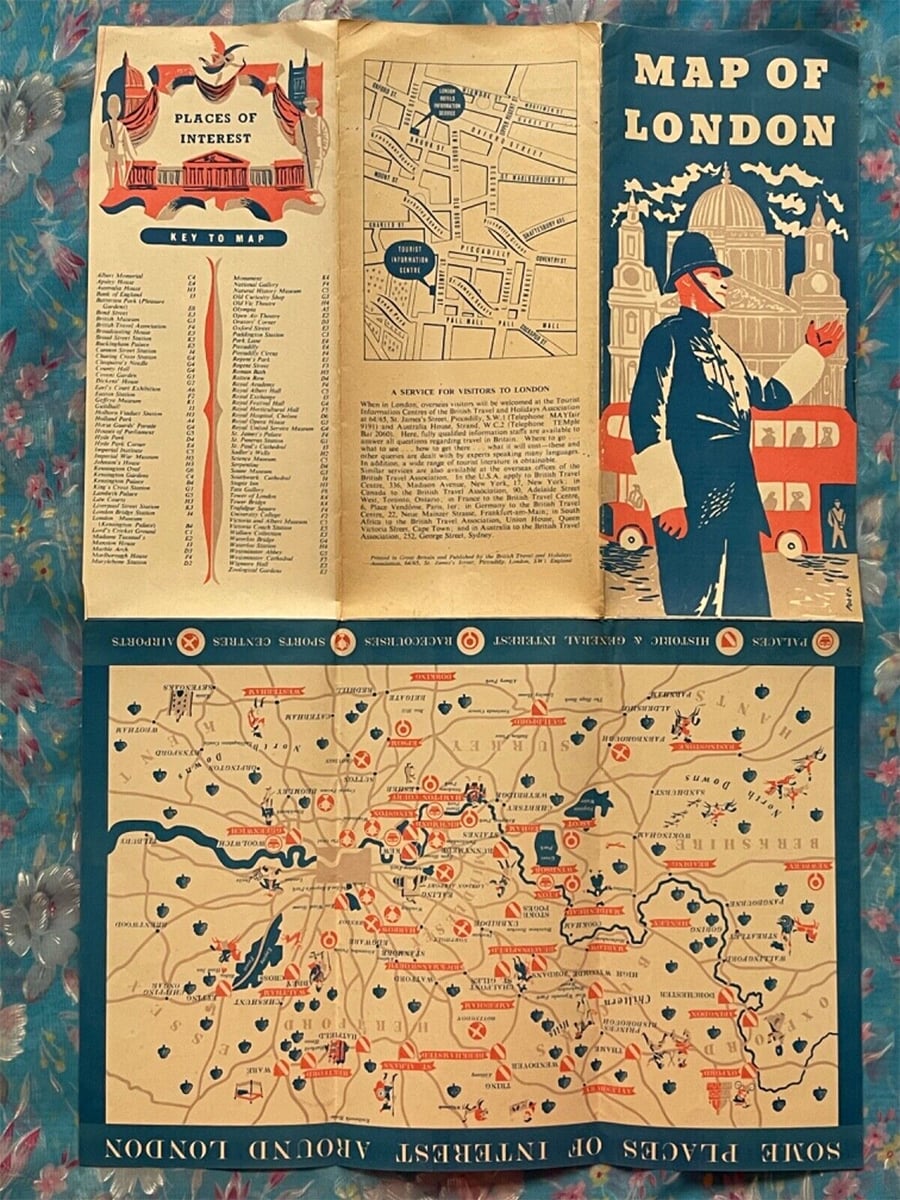 Vintage illustrated map of London showing landmarks, places of interest, and a key. The design features a man in a hat, St. Paul’s Cathedral, and a red double-decker bus, with navy, orange, and cream colors on floral background.