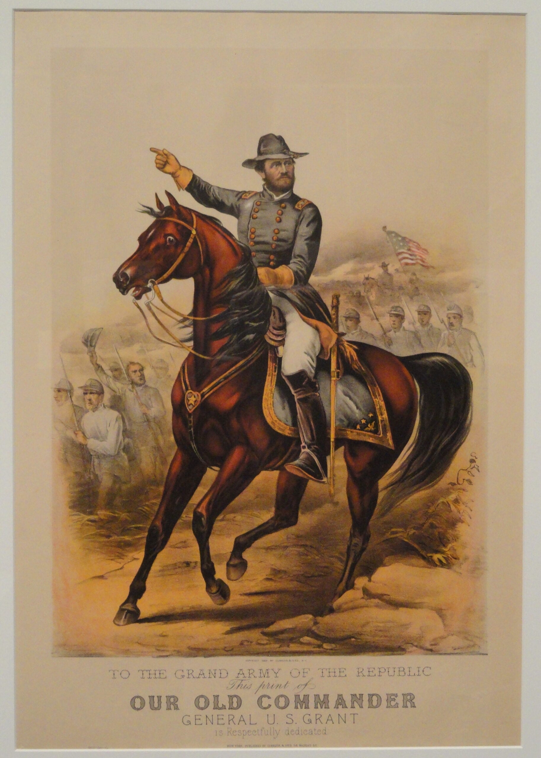 A color illustration of General Ulysses S. Grant on horseback, wearing a gray military uniform, with a group of Union soldiers and an American flag in the background. Text below dedicates the image to "Our Old Commander.