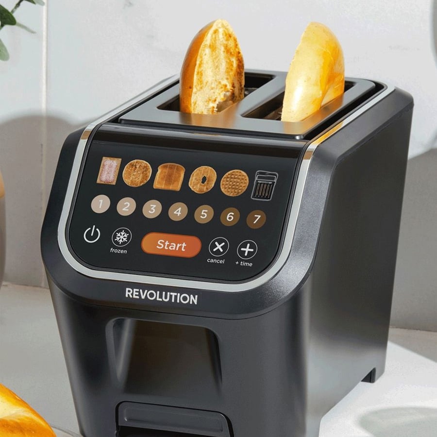 A black digital toaster with two slices of bread, featuring a touchscreen with various bread options, start, cancel, and time buttons, on a white kitchen countertop.