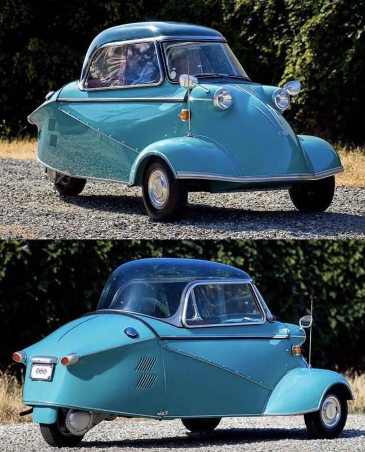 A small, turquoise, vintage microcar with three wheels, a bubble canopy, and round headlights is shown from the front and rear angles, parked outdoors on gravel with greenery in the background.